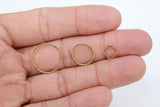 May include: Three gold jump rings, one large, one medium, and one small, with a gold square jump ring.